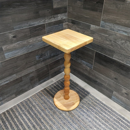 Guéridon en bois massif au pied torsadé sculpté