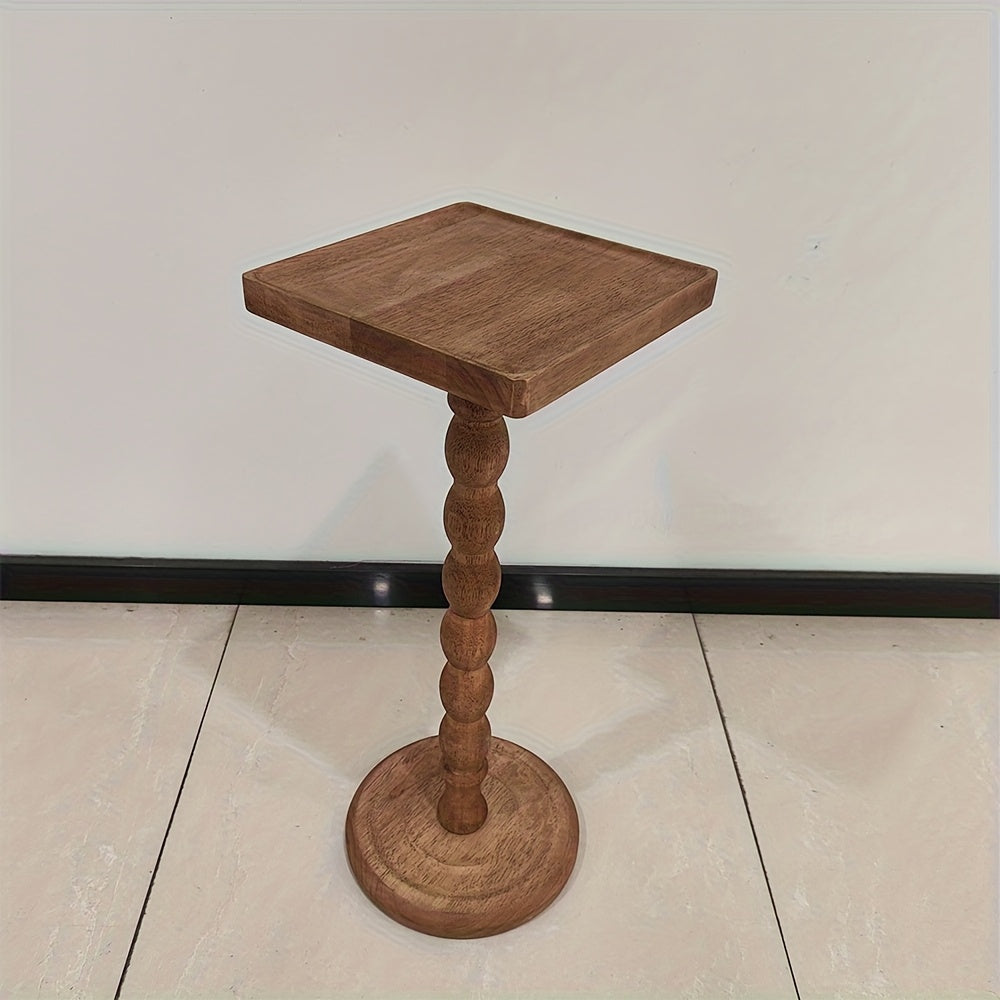 Guéridon en bois massif au pied torsadé sculpté