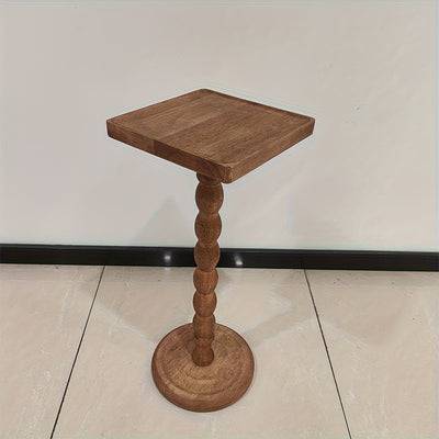 Guéridon en bois massif au pied torsadé sculpté